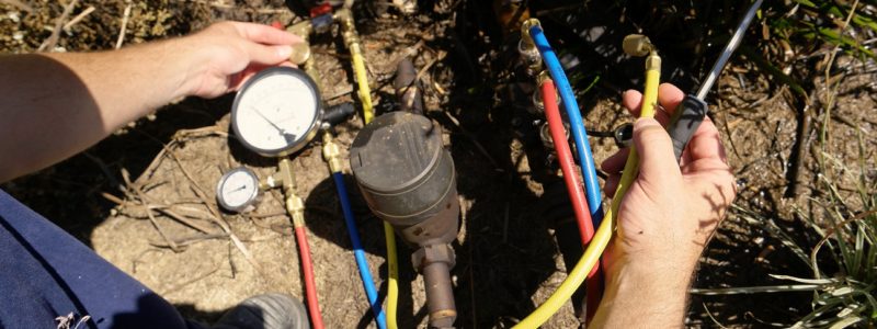 backflow device inspection taking place